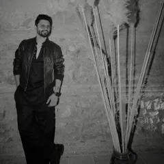 The same all-black look, captured in a classic black and white shot. This outfit is all about effortless style.