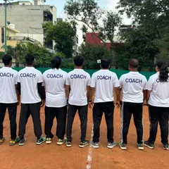The ILTA coaching staff, united and ready. The word "COACH" on our shirts represents our commitment and responsibility to every single player we train.