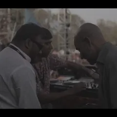 A behind-the-scenes moment, coordinating with the team before hitting the stage at a Holi festival.