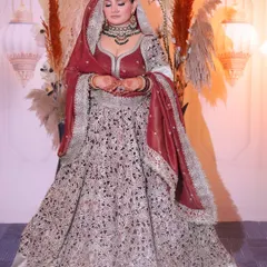 A full-length view of my own bridal look. The heavily embroidered lehenga and the rich velvet dupatta required a makeup look that was equally grand yet elegant.