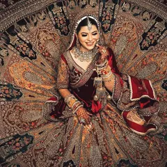 A bridal portrait showcasing the magnificent detail and spread of a velvet lehenga. I use creative angles and lighting to turn your bridal attire into a work of art, capturing its full grandeur.
