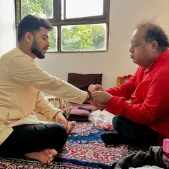 The 'Ganda-Bandhan' ceremony, where the guru ties a thread around the disciple's wrist, symbolizing the formal acceptance into the musical lineage.