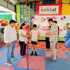 A proud moment at the summer camp finale as a student receives an award for the drawing competition. I believe in encouraging and rewarding creativity in all its forms.