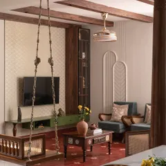 For this living room, I blended traditional Indian aesthetics with contemporary design. The space features antique wooden pillars, a classic swing, and rich textures to create a home that feels both rooted and innovative.