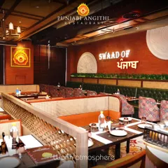 A glimpse of our warm and inviting atmosphere. We've created a space where you can relax and enjoy the authentic taste of Punjab.
