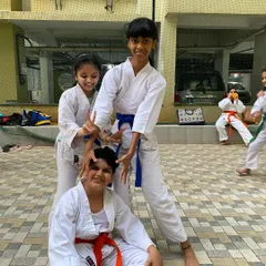 The playful side of our karate family. These moments of fun and camaraderie are just as important as the discipline we practice on the mat.