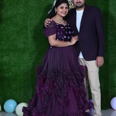 This dark purple ruffle gown is a great choice for functions or photoshoots. The floral details on the bodice and the layered skirt add a touch of elegance.