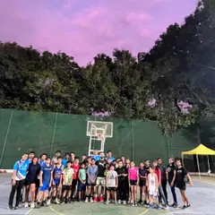 The whole group gathered under a beautiful evening sky after an inspiring session. We focus on building a strong and supportive basketball community.