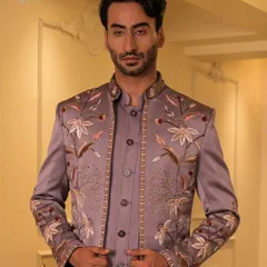 A closer look at the mauve Jodhpuri, highlighting the delicate beadwork and thread art along the placket and collar. Every detail is meticulously placed for a refined finish.