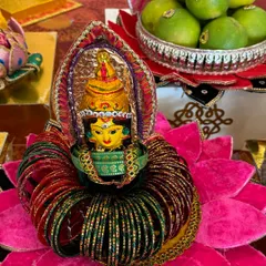 Another view of my bangle ceremony platter. The goddess figurine is surrounded by red and green bangles, all placed on a vibrant pink lotus base, making it a perfect centerpiece for the function.