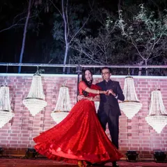 A candid moment of pure joy during our sangeet night. This is what it's all about. We choreograph performances that let you forget the steps and just live in the moment.