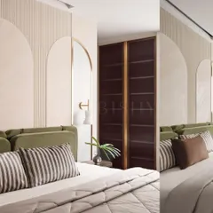 Details are what elevate a room from standard to stunning. In this bedroom, I used arched wall panels and fluting to create a soft, architectural backdrop. The deep olive green custom wardrobes with brass accents add a touch of bold color and luxury, demonstrating my focus on creating unique, built-in solutions.