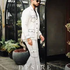 A full-length view of the all-white co-ord set with bold contrast stitching. This look is clean, sharp, and designed to make a powerful minimalist statement.