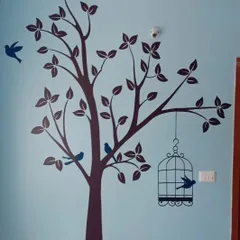 A duplicate view of the beautiful tree and birdcage stencil design. This wall art transforms a simple room into a peaceful, nature-inspired retreat.