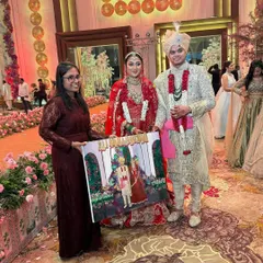 Presenting the finished canvas to the bride and groom in Gurugram. It's a moment of pure happiness and a wonderful photo opportunity for the couple.
