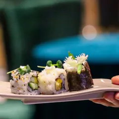 A trio of expertly crafted sushi rolls, showcasing different ingredients and techniques. Each piece is a testament to our commitment to freshness and artistry.