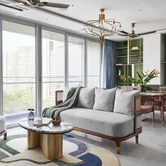 An expansive view of the Whimsical House, showcasing an open-plan living, dining, and kitchen area. I designed this space to feel bright, airy, and connected, using a playful color palette and custom furniture like the 'Ananta' center table to create a home that is both stylish and perfect for family life.