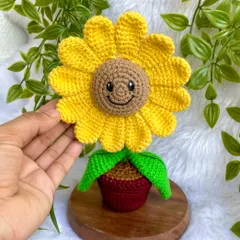 Holding the smiling sunflower pot. The cheerful expression on this flower is one of my favorite details to add.
