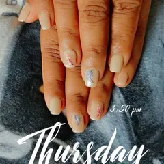 A minimalist art design on nude nails, with delicate, feather-like strokes in red and silver on two accent nails.