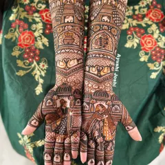 This full bridal design captures the essence of a royal wedding. The palms show the bride and groom, while the arms are filled with palace architecture, peacocks, elephants, and swans.