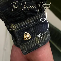 A cufflink is more than an accessory; it's a signature. This piece features a unique triangular design in polished gold, centered with a brilliant diamond, created to add a subtle yet powerful finishing touch to your cuff.