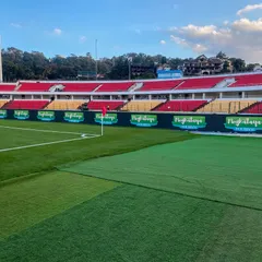 A ground-level view of the pristine pitch and our perimeter LED setup in Shillong. Our technical team ensures seamless integration of technology into the stadium environment.