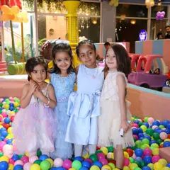 A group of friends enjoying the vibrant ball pit. It's a fantastic place for social play and making new buddies during a drop-in session.