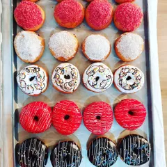 A tray of colorful and delicious donuts made in our baking diploma course. You will learn how to make the dough, fry it to perfection, and create a variety of glazes and toppings.