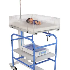 This is another angle of a phototherapy unit and infant warmer, shot on a white background to ensure clarity and focus on the equipment's features.