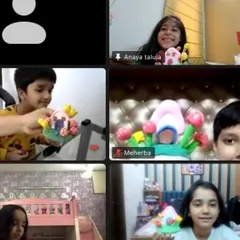 A screenshot from our "fun clay day" online workshop. It's wonderful to see so many happy faces and their colorful miniature clay houses.
