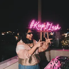 Me in my element at a Lush Loft rooftop party in Delhi. The '#KeepItLush' neon sign says it all. These parties are my creative playground, where I can experiment with sounds and create a truly personal and welcoming atmosphere.