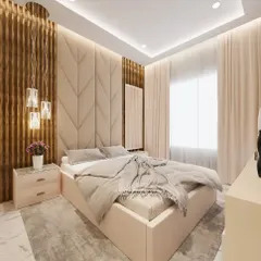 A beautiful bedroom design combining textures for a warm, inviting feel. The room features a chevron-patterned upholstered headboard, vertical wooden fluting, and elegant hanging pendant lights next to the bed.