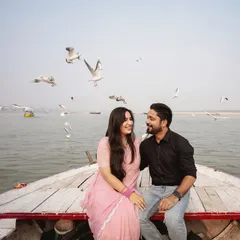 Our photography focuses on capturing your unique story. This pre-wedding photoshoot in Banaras uses the natural beauty of the Ganges and the morning light to create a timeless, romantic portrait of the couple on a traditional boat.