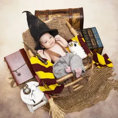 For fans of fantasy, I offer fully styled themes like this Harry Potter newborn shoot. The setup includes a sorting hat, magic wand, house scarf, and other iconic props to create a magical first portrait.