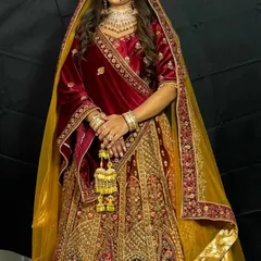 A full view of the magnificent Rajwadi bridal lehenga, showcasing its rich velvet fabric and detailed embroidery.