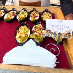 My modern take on a classic, Palak Patta Chaat. Crispy spinach leaves are topped with yogurt and chutneys, served in individual mini pans for a clean and stylish presentation.