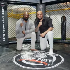 A shot of me and our event announcer inside the octagon. We've built a professional environment for both training and competition.
