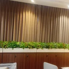 Another view of the long office planter, showing how it adds a consistent line of green across the top of the storage units.