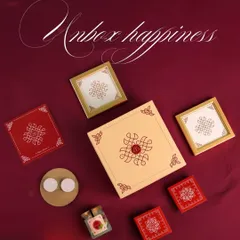 Unbox happiness this Diwali. This flat lay shot showcases one of our festive hampers, featuring beautifully designed boxes, diyas, and treats that capture the essence of the festival.