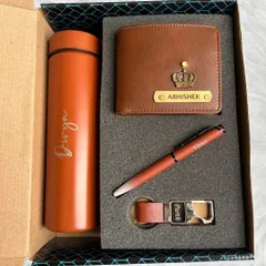 This is my popular Black Box Combo, shown here in a stylish tan color. The set includes a personalized 700ml turbo bottle, a Nexon men's wallet, a matching pen, and a hook keychain, all neatly presented in a custom-fit gift box.