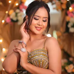 The complete look. This hairstyle perfectly complements the glamorous makeup and outfit, creating a cohesive and stunning appearance for any evening wedding event.