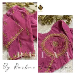 A beautiful pink velvet blouse with a unique circular embroidery pattern on the back. The sleeves have delicate butis to match.