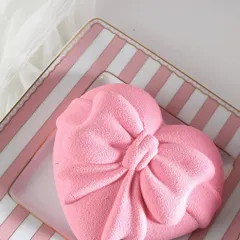 A heart wrapped in a bow. This pink velvet heart-shaped mousse cake is made with layers of white chocolate and refreshing strawberry. Pure bliss in every bite.