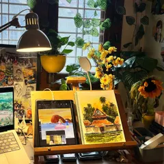 My happy place. This is my studio desk, filled with plants, art supplies, and ongoing projects. It's where my art meets my heart.