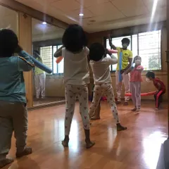 A look at our outdoor program, where we bring "Serious Fun" right to your apartment's doorstep. These images show kids enjoying gymnastics and yoga on mats in both indoor and outdoor community spaces.