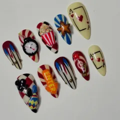 Feeling lucky? This casino themed set is all about high stakes and high fashion. I went all out with 3D details like a tiny popcorn bucket, a clock, and playing cards. It's a bold, maximalist design for when you want your nails to do all the talking.
