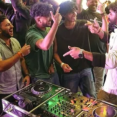 I'm not a DJ who hides in the corner. This shot from the Under 25 Summit captures how I get right into the crowd, hyping everyone up and making the party an interactive experience for everyone involved.