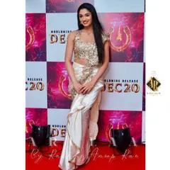 For the 'UI' movie promotions, I designed this concept saree for Reeshma Nanaiah. The highlight is the heavily embellished halter-neck blouse, paired with a pre-draped satin saree for a modern, red-carpet-ready look.