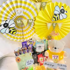 What will it bee? This jumbo "Mommy to Bee" hamper is buzzing with excitement, packed with snacks, a cute teddy bear, and a countdown tracker for the baby's arrival.