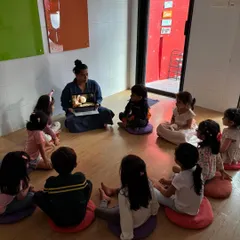Our classroom is a space for shared learning. Sitting in a circle for interactive reading sessions helps build a sense of community, encouraging students to ask questions and discuss stories together.